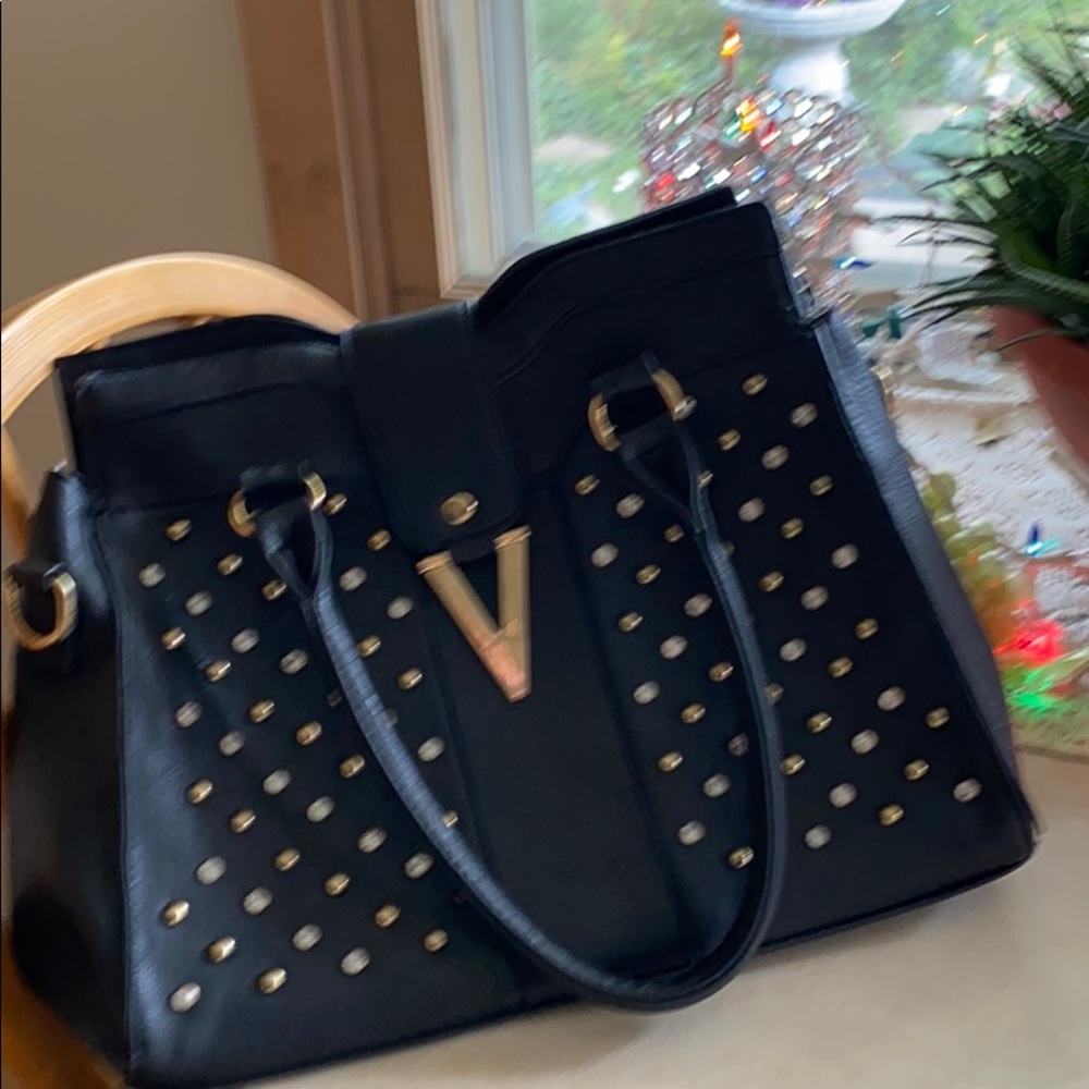 Black purse with studs and diamonds